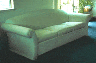 upholstered couch before custom slipcover