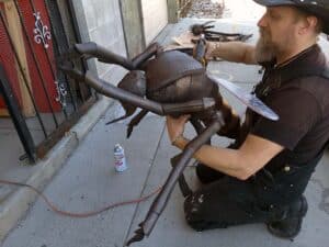 Hraefn Wulfson adding a few final touches to the dead mosquito prop